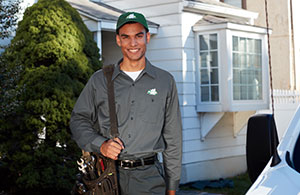 Service tech standing in front of home