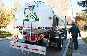 Service tech walking towards Wallace oil truck